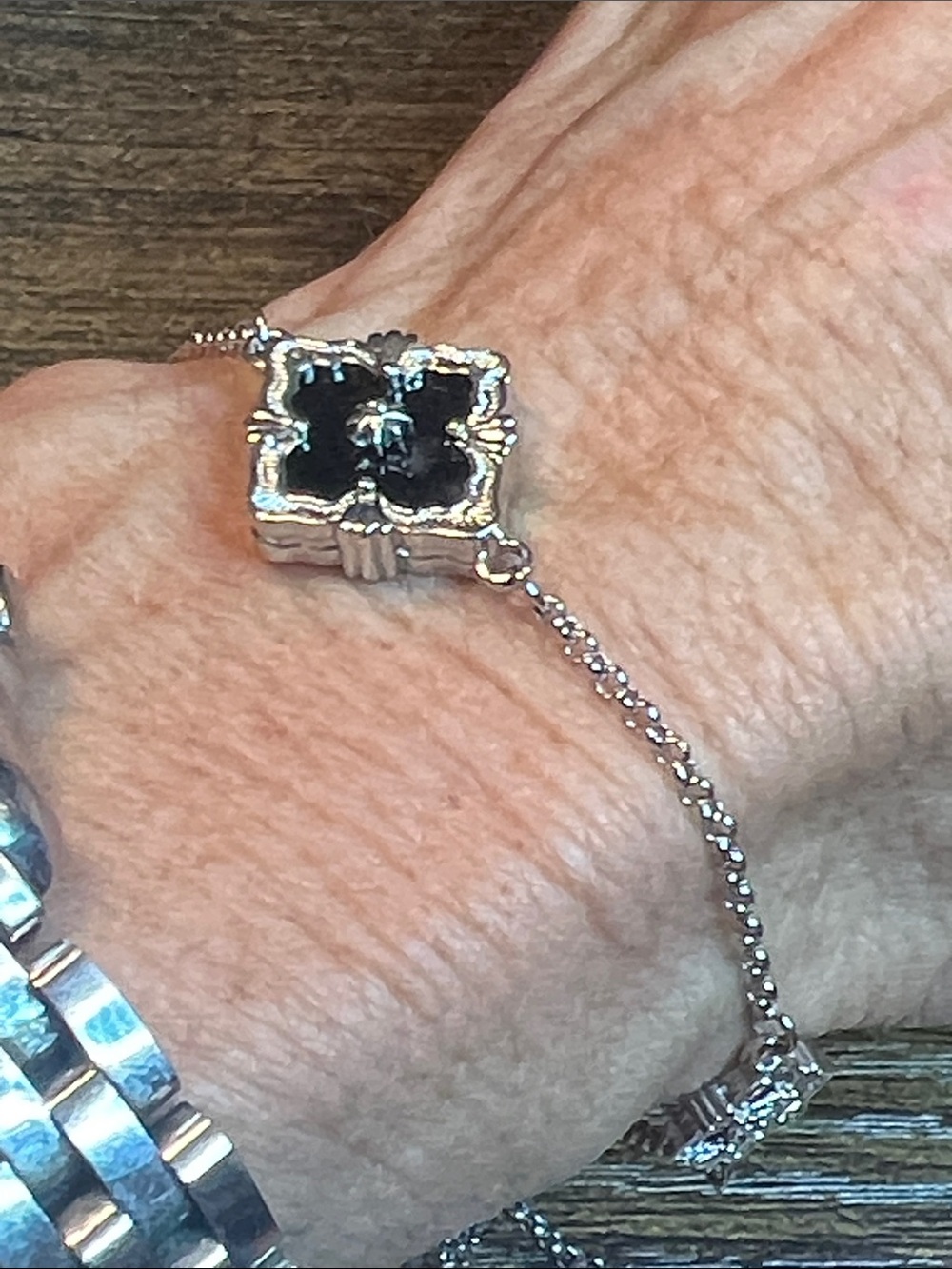 Silver Chain Bracelet with Black Floral Motif